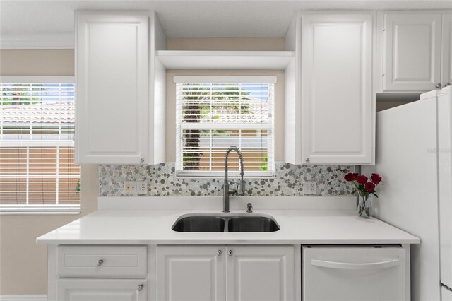 11863 Delfina Ln, Orlando, FL 32827 - kitchen with a sink, white appliances, and white cabinets