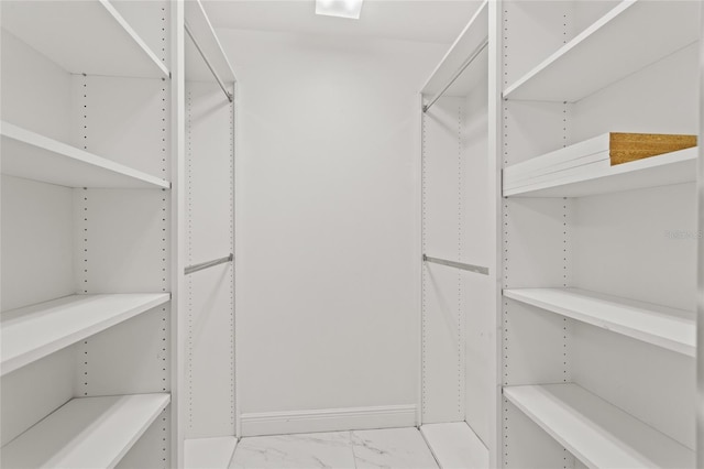 11863 Delfina Ln, Orlando, FL 32827 - spacious closet featuring light marble finish floors