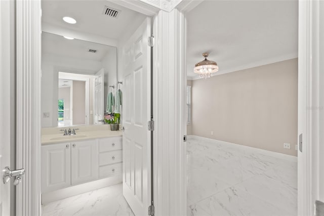 11863 Delfina Ln, Orlando, FL 32827 - bathroom featuring marble finish flooring, a chandelier, vanity, and baseboards