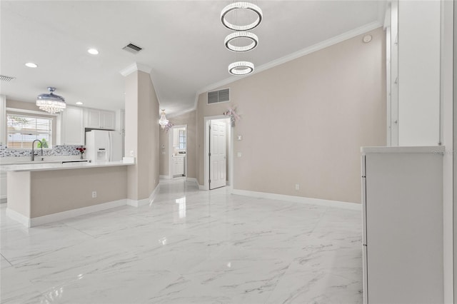 11863 Delfina Ln, Orlando, FL 32827 - unfurnished living room featuring crown molding, baseboards, recessed lighting, light marble finish flooring, and a sink