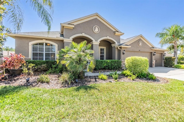 8721 Crystal Creek Ct, Land O Lakes, FL 34638 - view of front of home featuring a garage, a front lawn, stucco siding, and driveway