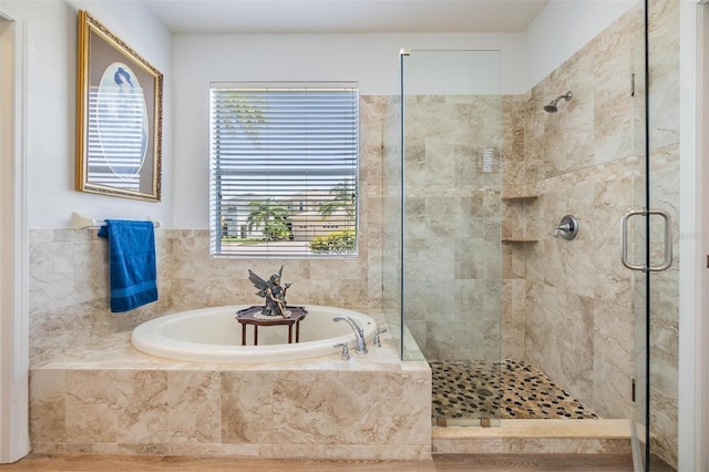 8721 Crystal Creek Ct, Land O Lakes, FL 34638 - bathroom featuring a shower stall and a bath