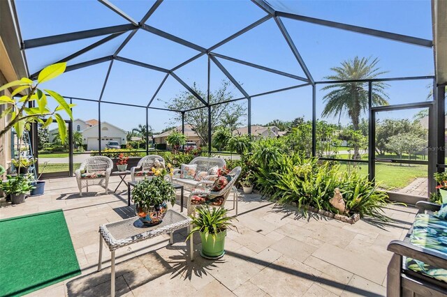 8721 Crystal Creek Ct, Land O Lakes, FL 34638 - view of patio with an outdoor hangout area, glass enclosure, and a residential view
