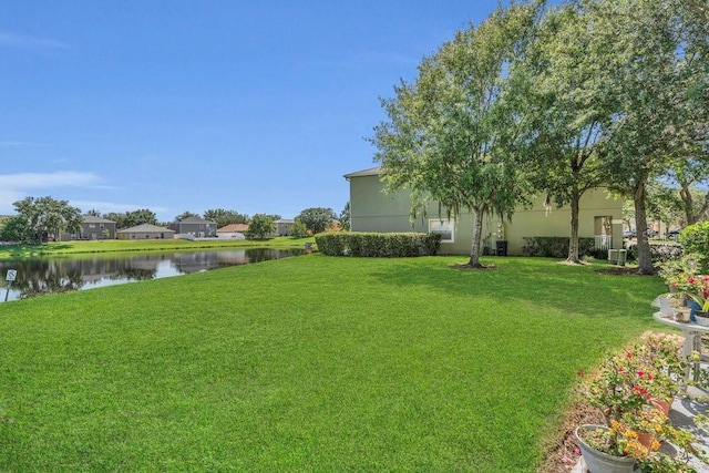 13480 Applerose Ln Unit 19, Orlando, FL 32824 - view of green lawn with a water view