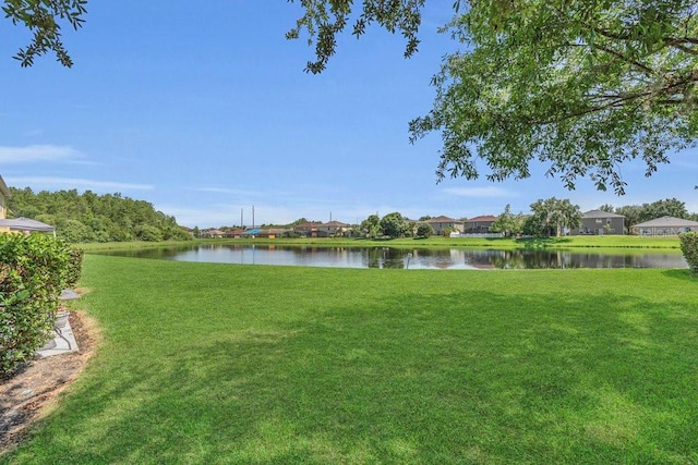 13480 Applerose Ln Unit 19, Orlando, FL 32824 - view of grassy yard featuring a water view