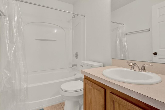 1744 Pine Ridge Dr, Davenport, FL 33896 - full bath with toilet, shower / bathtub combination with curtain, tile patterned flooring, and vanity