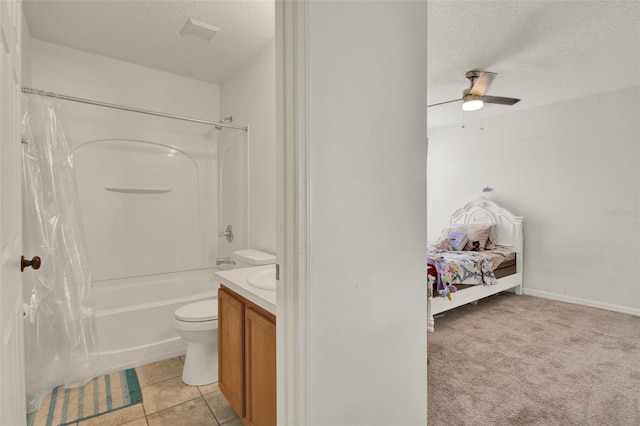 1744 Pine Ridge Dr, Davenport, FL 33896 - ensuite bathroom featuring a textured ceiling, a ceiling fan, toilet, shower / tub combo with curtain, and vanity