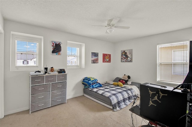 1744 Pine Ridge Dr, Davenport, FL 33896 - bedroom featuring light colored carpet, baseboards, a textured ceiling, and ceiling fan