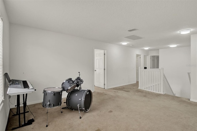 1744 Pine Ridge Dr, Davenport, FL 33896 - misc room featuring an upstairs landing, carpet, a textured ceiling, and baseboards