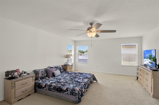 1744 Pine Ridge Dr, Davenport, FL 33896 - bedroom featuring light colored carpet, a textured ceiling, a ceiling fan, and baseboards
