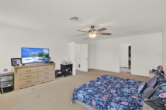 1744 Pine Ridge Dr, Davenport, FL 33896 - bedroom featuring light colored carpet and ceiling fan