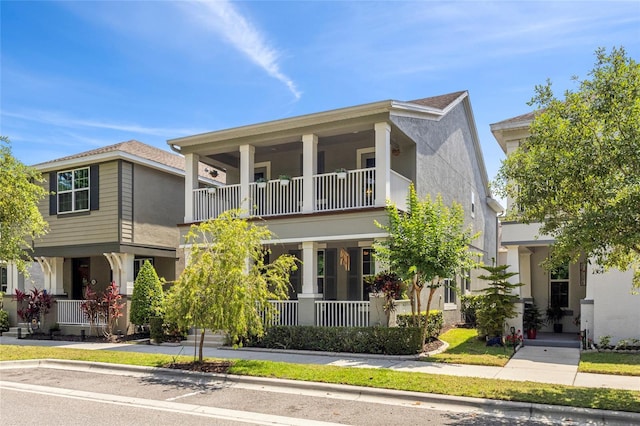 308 Michael Blake Blvd, Winter Springs, FL 32708 - view of front of house with a balcony, a porch, and stucco siding