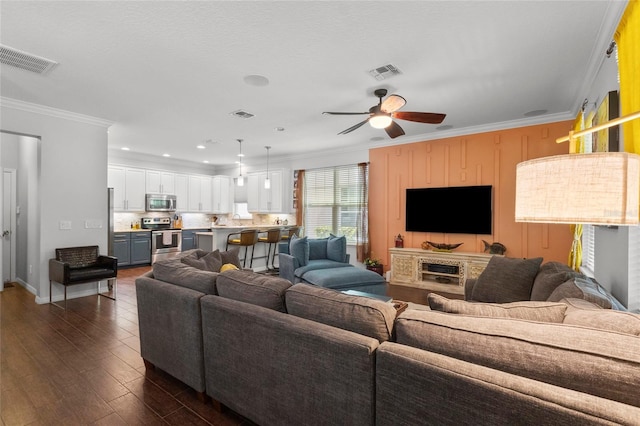 308 Michael Blake Blvd, Winter Springs, FL 32708 - living room with ornamental molding, ceiling fan, dark wood-style flooring, baseboards, and recessed lighting