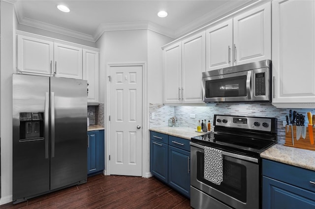 308 Michael Blake Blvd, Winter Springs, FL 32708 - kitchen with appliances with stainless steel finishes, blue cabinetry, dark wood-type flooring, white cabinetry, and ornamental molding