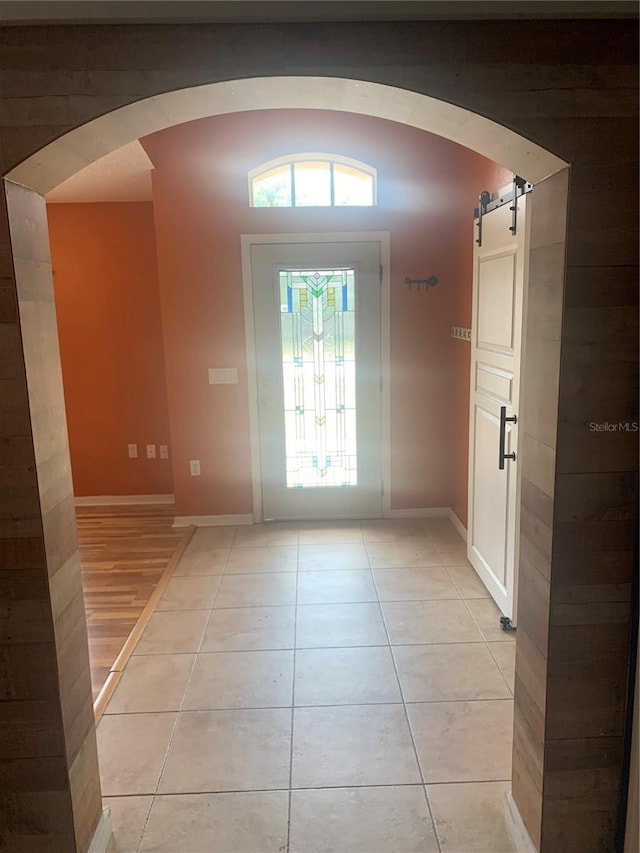 701 Twin Lake Ave, Deltona, FL 32738 - entryway featuring light tile patterned flooring, arched walkways, and baseboards
