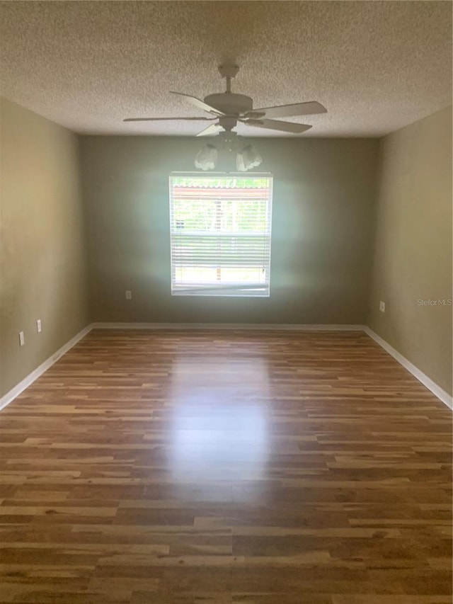 701 Twin Lake Ave, Deltona, FL 32738 - empty room featuring wood finished floors, ceiling fan, baseboards, and a textured ceiling