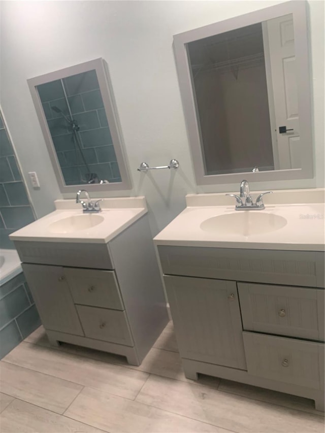 701 Twin Lake Ave, Deltona, FL 32738 - full bath with two vanities and a tub