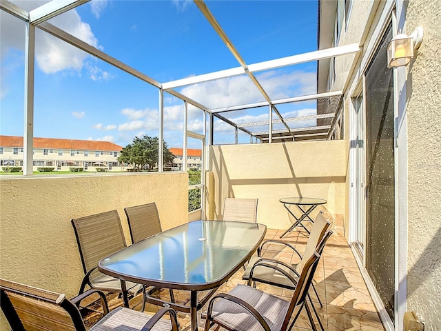 sunroom featuring outdoor dining area