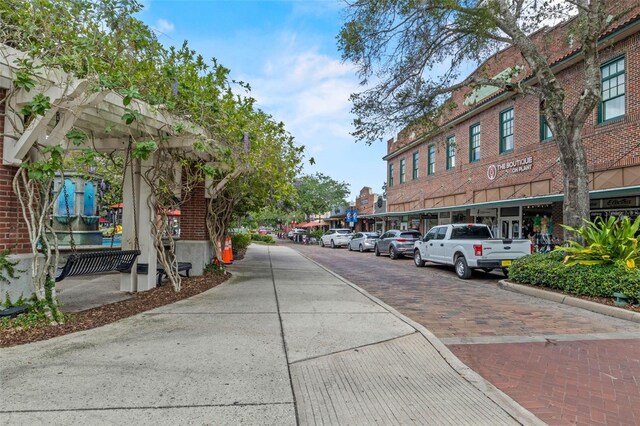 711 Valencia Ct, Winter Garden, FL 34787 - view of decorative street featuring curbs, sidewalks, and street lights
