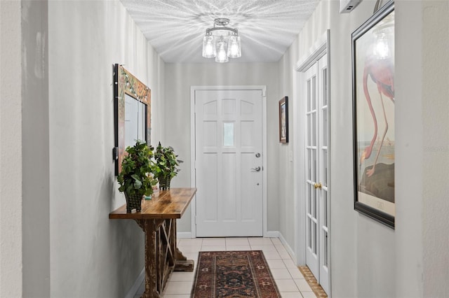711 Valencia Ct, Winter Garden, FL 34787 - foyer entrance with light tile patterned flooring, a chandelier, and baseboards