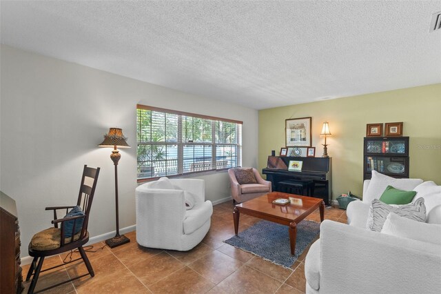 711 Valencia Ct, Winter Garden, FL 34787 - tiled living area featuring a textured ceiling and baseboards