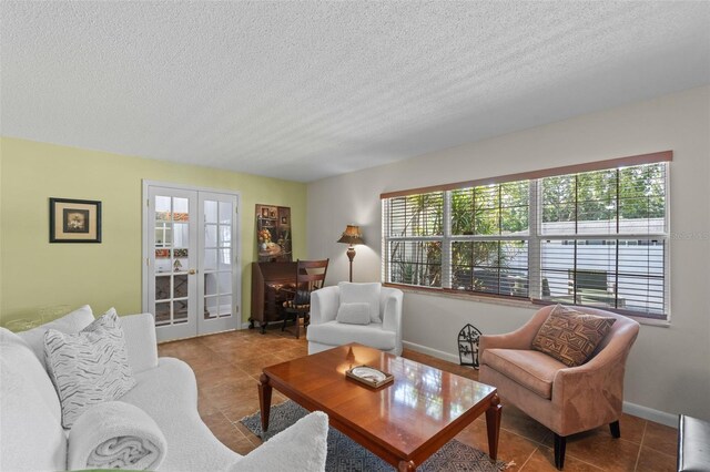 711 Valencia Ct, Winter Garden, FL 34787 - tiled living area with a textured ceiling, french doors, and baseboards