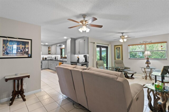 711 Valencia Ct, Winter Garden, FL 34787 - living area featuring light tile patterned floors, ceiling fan, baseboards, a textured ceiling, and recessed lighting