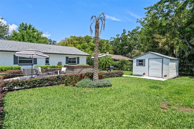 711 Valencia Ct, Winter Garden, FL 34787 - view of green lawn featuring a storage shed, an outbuilding, and central AC unit