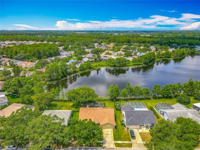 aerial view of residential area with a large body of water
