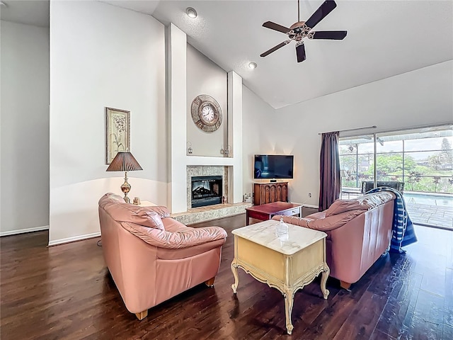 living room with high vaulted ceiling, ceiling fan, wood finished floors, a fireplace with raised hearth, and recessed lighting