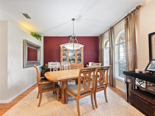 1319 Castleport Rd, Winter Garden, FL 34787 - dining space with baseboards and light wood-style flooring