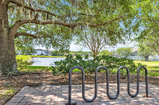 surrounding community featuring a water view
