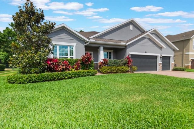 595 American Holly Pl, Oviedo, FL 32765 - ranch-style home featuring a garage, a front yard, driveway, and stucco siding