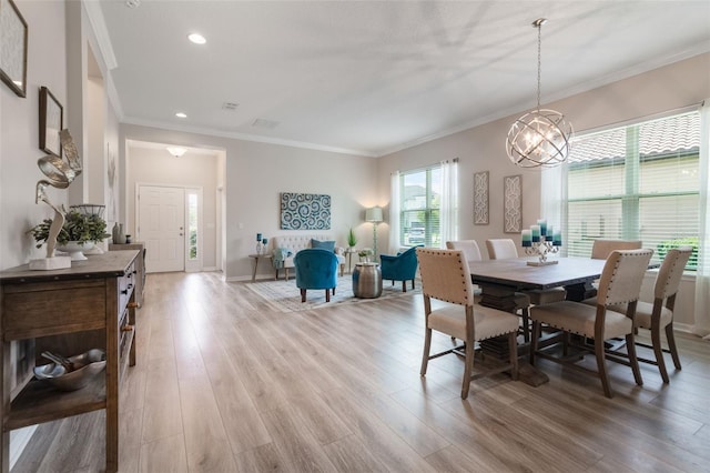 595 American Holly Pl, Oviedo, FL 32765 - dining space with a chandelier, ornamental molding, light wood-type flooring, recessed lighting, and baseboards