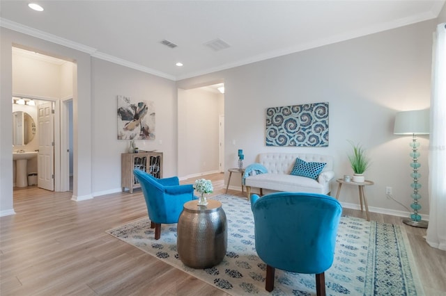 595 American Holly Pl, Oviedo, FL 32765 - sitting room with baseboards, light wood-style flooring, recessed lighting, and crown molding