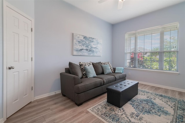 595 American Holly Pl, Oviedo, FL 32765 - living room with a ceiling fan, light wood-type flooring, and baseboards