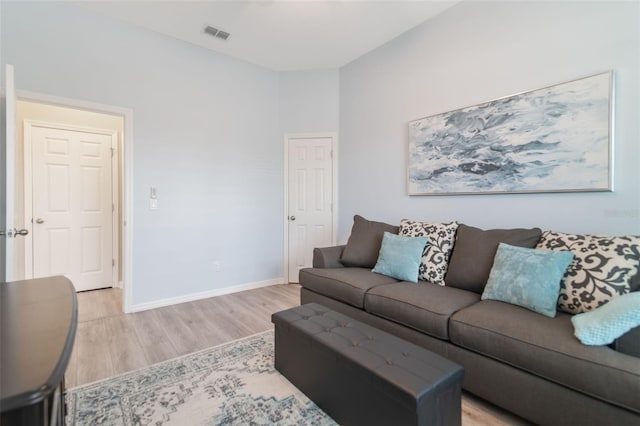 595 American Holly Pl, Oviedo, FL 32765 - living area with light wood-style floors and baseboards