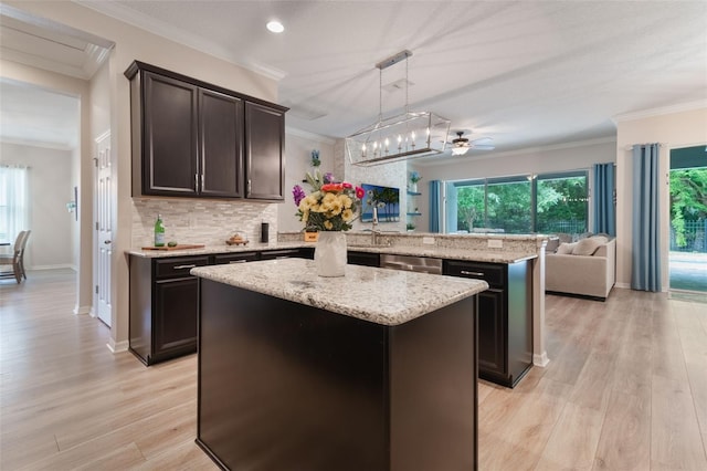 595 American Holly Pl, Oviedo, FL 32765 - kitchen featuring a peninsula, ceiling fan, ornamental molding, open floor plan, and dishwasher
