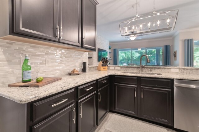595 American Holly Pl, Oviedo, FL 32765 - kitchen with dishwasher, a sink, backsplash, ornamental molding, and light stone counters