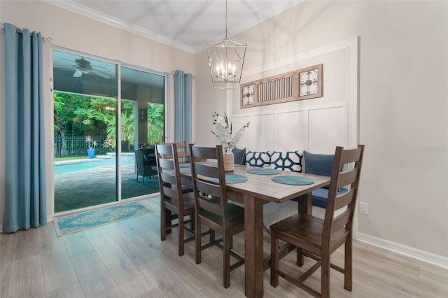 595 American Holly Pl, Oviedo, FL 32765 - dining room with light wood-style floors, a chandelier, ornamental molding, and ceiling fan