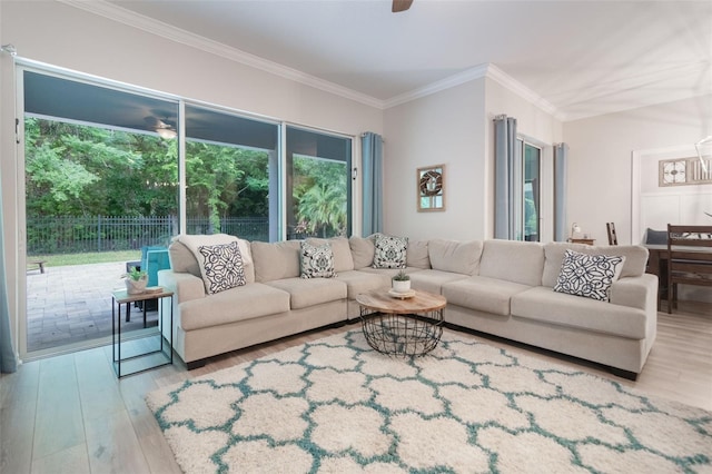 595 American Holly Pl, Oviedo, FL 32765 - living room featuring wood finished floors, ornamental molding, and a ceiling fan