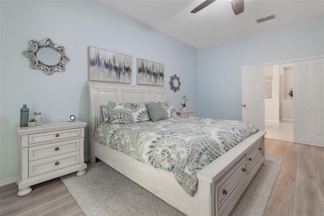 595 American Holly Pl, Oviedo, FL 32765 - bedroom with light wood-type flooring, a ceiling fan, and baseboards