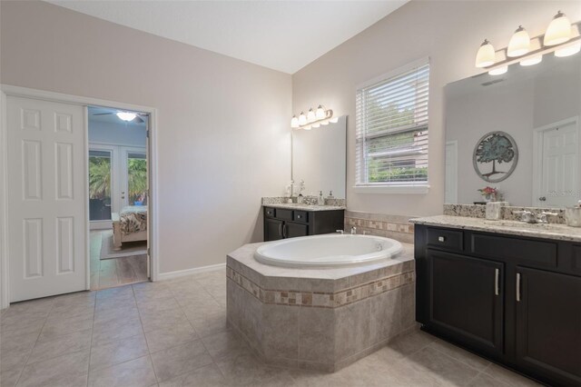 595 American Holly Pl, Oviedo, FL 32765 - bathroom with ensuite bath, healthy amount of natural light, a garden tub, and two vanities