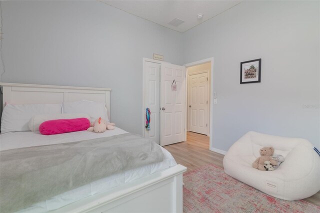 595 American Holly Pl, Oviedo, FL 32765 - bedroom with wood finished floors and baseboards