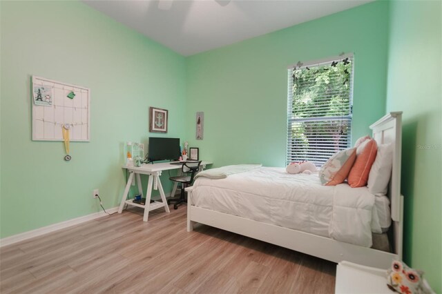 595 American Holly Pl, Oviedo, FL 32765 - bedroom with wood finished floors, baseboards, and a ceiling fan