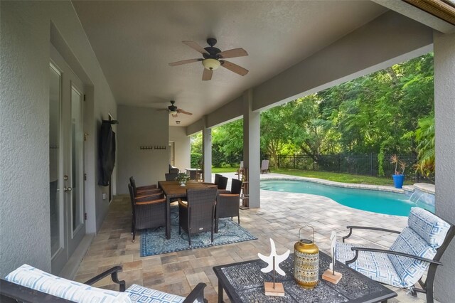 595 American Holly Pl, Oviedo, FL 32765 - view of patio featuring a fenced backyard, outdoor dining space, ceiling fan, and an outdoor hangout area
