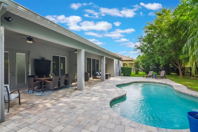 595 American Holly Pl, Oviedo, FL 32765 - swimming pool with ceiling fan, a patio area, and outdoor dining area