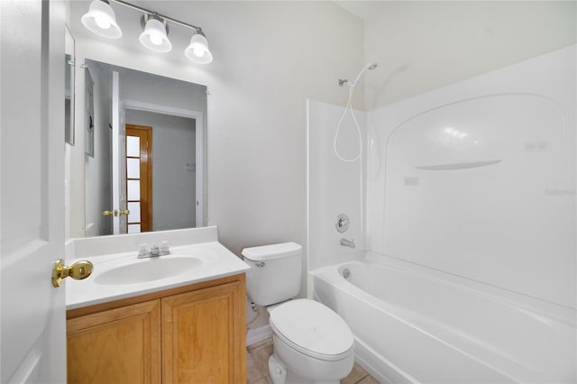 bathroom featuring toilet, vanity, and washtub / shower combination