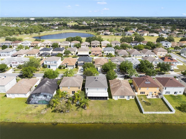 aerial perspective of suburban area with a large body of water