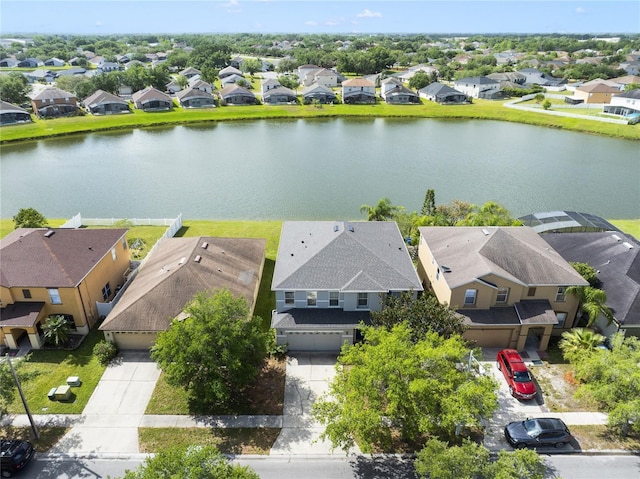 aerial perspective of suburban area featuring a nearby body of water